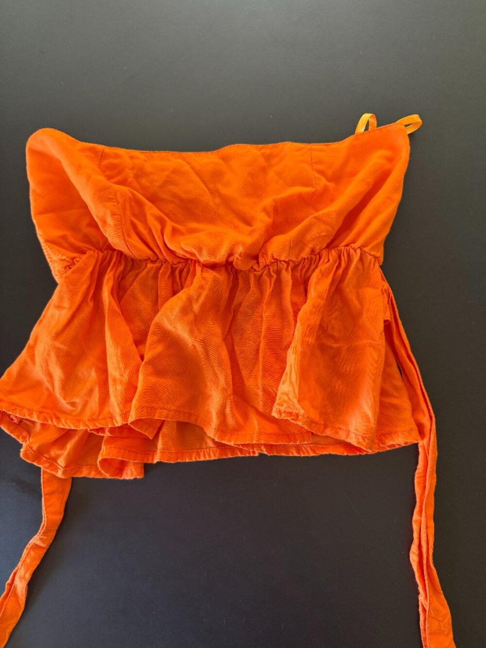 Valija XS Orange Strapless Smocked Peplum Tie Waist Top
